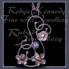10 Karat Yellow Gold, Sterling Silver and Ice Blue Topaz 'Feeling Groovy' Pendant Image